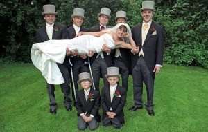 Morning suits and top hats at a wedding