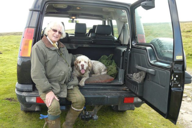 Clumber spaniel with owner