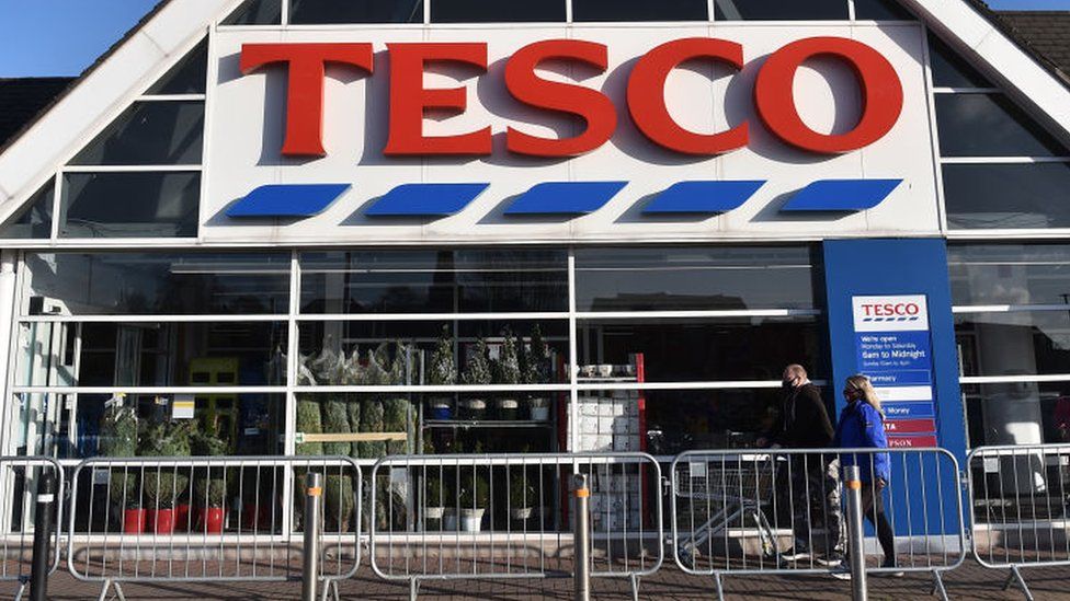 Tesco vows to rein in prices as profits treble